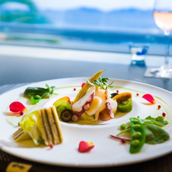 Appetizer enjoyed by a window overlooking the sea