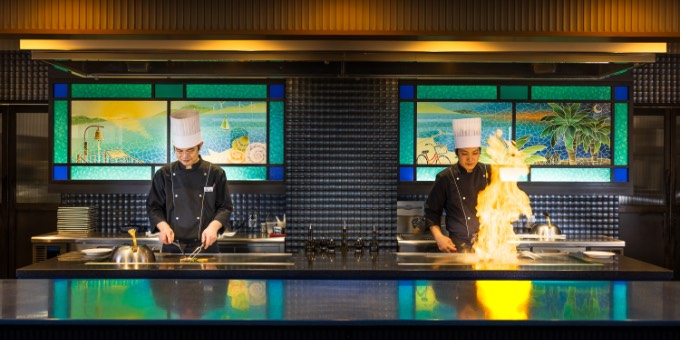 Chef preparing teppanyaki at the AO open kitchen